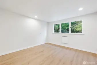 Bedroom #3 un-staged, it also enjoys a peaceful wooded setting views.