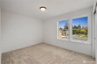 Secondary Bedroom (Front-Facing):  This bright upper-level bedroom features soft neutral carpet, clean modern trim, and oversized windows that overlook the newly completed Gooden Hollow streetscape. The generous layout adapts easily to a variety of needs, offering a calm and comfortable space with excellent natural light throughout the day. Set within Bothell’s desirable Canyon Park micro-area, the room enjoys quick access to local parks, Northshore amenities, and commuter routes connecting the greater Eastside. Its simple, streamlined finishes make it an easy room to personalize, whether for work, rest, or creative use.    These photos are from Lot 5 at Gooden Hollow, which is the same floorplan, but a different home than listed here. However, other homes in the community will have changes, so all photos, renderings, site maps, and floorplans are for visualization purposes only. Plans, colors, building orientation, finishes, home outlook, and other details can and WILL vary.