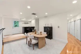 Dining room adjacent to the kitchen and deck for seamless indoor-outdoor gatherings
