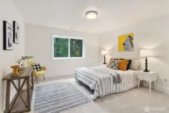 Light and bright secondary bedroom with large window and closet.