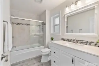Nicely updated main bath with clean, modern finishes.