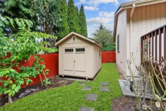 Handy outbuilding/shop for tools, projects, or extra storage.