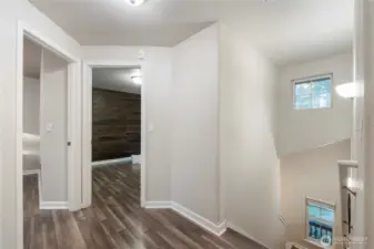 The upstairs landing is bright & cheery like the rest of the home