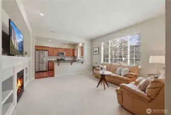 Open living area leads to the stunning kitchen with eating bar.
