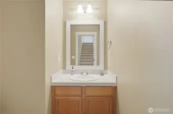 Powder room off formal entry.