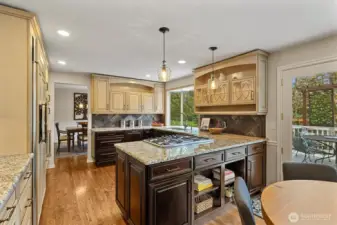 Under counter and buffet lighting as well as a wall of windows facing the backyard.