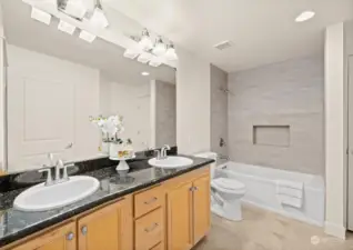 Ensuite bathroom on the main level (staged)