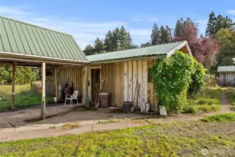 View of breezeway and entrance to workshop and meat locker/freezer.