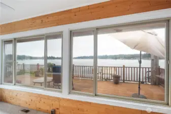 Fantastic lake view from the sunroom, French doors lead you to the wrap around deck.