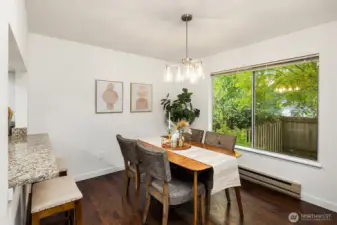 Dining area looks out to private backyard.