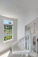 Stairway leading to upstairs - the filtering natural light is so pretty through this window!