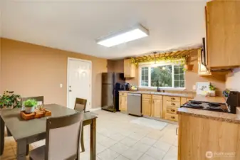 This roomy eat-in kitchen anchors the home—ideal for everyday meals or weekend baking sessions.