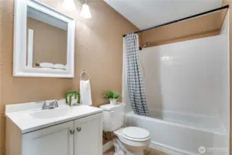 This sparkling full bath is bright, clean, and ready for everyday living.