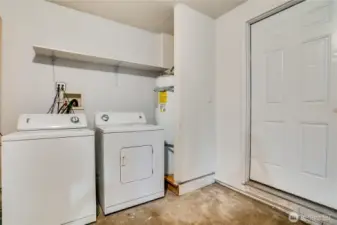 The attached garage includes a washer and dryer, attic storage, and a handy workbench for projects.