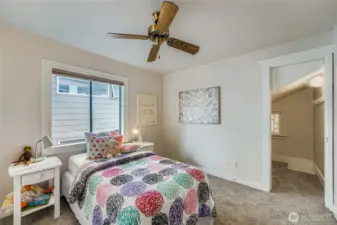 Bedroom at the back of the house, with a walk-in closet.