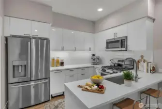 (Virtually Staged) Kitchen with quartz countertops, stainless steel appliances, and custom cabinet organizers