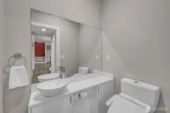 Main floor deluxe powder room off entry has heated seat and bidet