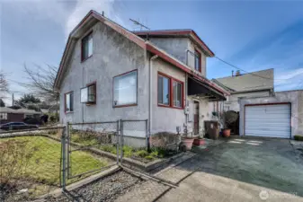 Fully fenced corner lot with detached single car garage.