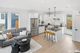 Enjoy indoor outdoor living with back door leading to a fully fenced yard with patio.