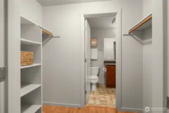 Walk in closet with access to the bathroom