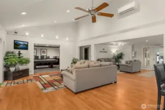 Seating areas with billiards room on the top left of photo