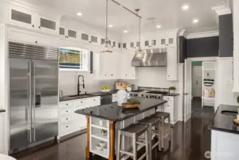 42" subzero refrigerator and commercial 6 burner Viking range with double oven are among many features.