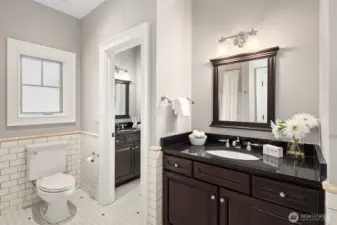 Jack n Jill bathroom (with tub) between the 2 bedrooms and includes 2 sink areas.