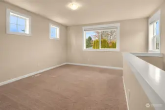 Upstairs open concept family room with lots of natural light