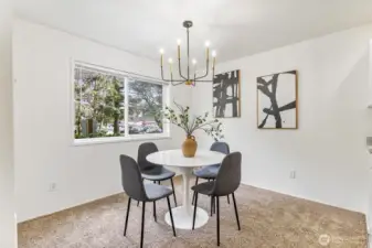 The dining room offers the perfect blend of functionality and charm, featuring ample space for a dining set and decor.