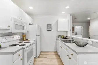 Open-concept design flows effortlessly into the dining and living areas, making meal prep a delight.