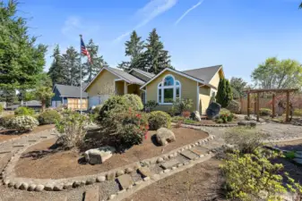 Front of the house showing professional landscaping.