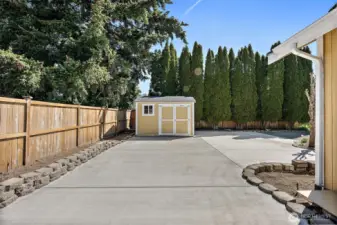 New Tuff Shed completely wired with lights. 8" thick RV Pad with a 30 amp plugin.