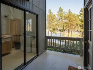 Common laundry room adjacent to unit