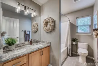Upstair bathroom is updated with granite counters and tile flooring.