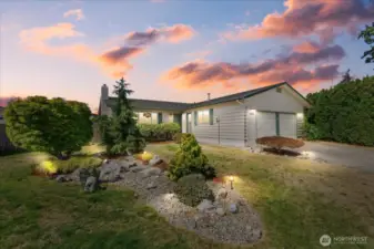 Beautiful sunsets are seen from the rear yard of this wonderful home.