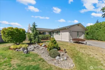 Pride of ownership is found throughout this Cul de sac of homes. Rockery Landscaping in front is on the property line and is shared with the neighbor.