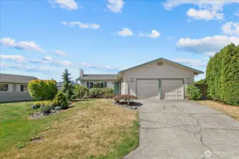 A long Driveway offers additional Parking. Rockery Landscaping in front is on the property line and is shared with the neighbor.