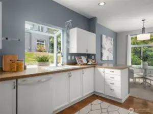 Open kitchen design has connection to dining room