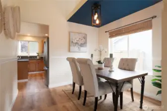 The formal dining room offers an inviting space for special gatherings and celebrations. With its natural light, it’s perfect for hosting dinner parties or enjoying special meals in style.