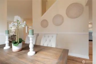 The classic chair rail details add a touch of timeless elegance to the space. Not only do they provide architectural interest, but they also create a polished backdrop for both formal and casual gatherings.