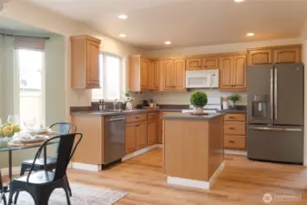 The kitchen flows seamlessly to the sunny eating nook and family room ensuring that everyone stays connected—whether cooking, dining, or relaxing by the fire. Perfect for both everyday living and entertaining, this layout creates a natural gathering place or area to relax.