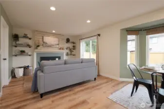 The cozy family room is the perfect spot to unwind, featuring a warm gas fireplace that creates an inviting atmosphere in these chilly Fall days. Conveniently located with direct entry from the garage and an adjacent laundry room, this space blends comfort with practicality.