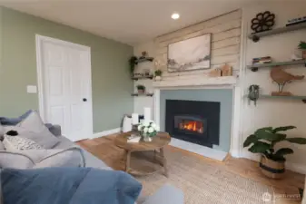 With the gas fireplace glowing, the family room becomes a cozy haven. The direct deck access makes it versatile for every season.