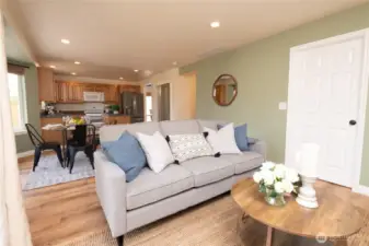 View back to the kitchen eating nook, walk in pantry and kitchen. Door to the laundry room then out to the garage conveniently located at right of photo.