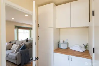 Main floor laundry room with Washer/Dryer hookup and plenty of storage! Even a place to fold your laundry.