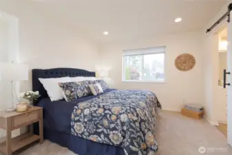 The generous Primary suite is a true retreat. Enjoy a remodeled en suite bath and spacious walk-in closet. Soft, neutral carpet underfoot.