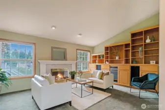 Soaring ceilings, neutral tones, and timeless trim details enhance the room’s sophisticated yet welcoming feel—perfect for quiet mornings or evening entertaining.