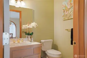 Guest powder room conveniently located just off the main living area.