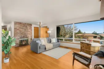 Wood floors, fireplace, and MCM charm