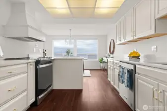 Enjoy cooking and entertaining in this view kitchen, with newer appliances and wood-like luxury vinyl flooring